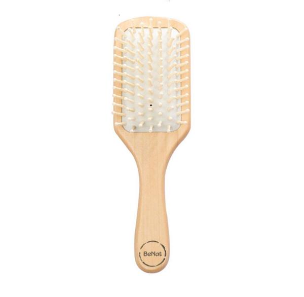 Natural wooden detangling hair brush with bamboo bristles and rubber cushioning for gentle, static-free hair care