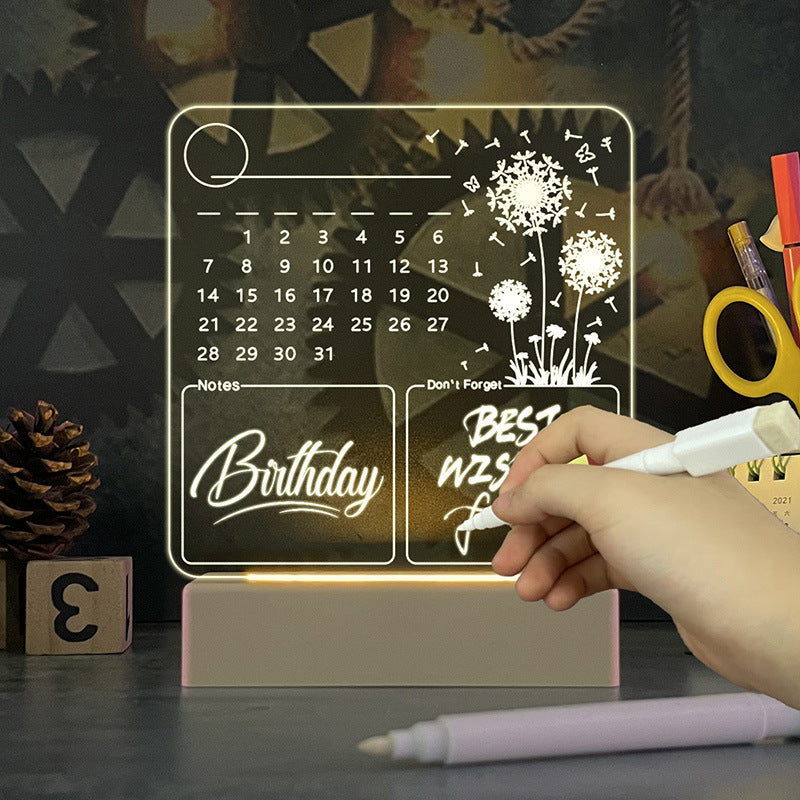 Acrylic calendar memo board with glowing LED night light and dandelion design on desk