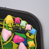 Reflexology Foot Massage Pad in black with colorful curved plastic massage stones and an acupoints map pattern, non-slip edge trim.