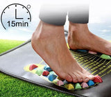 Reflexology Foot Massage Pad in black with colorful removable plastic massage stones and acupressure points for foot pain relief.