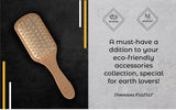 Natural wooden detangling hair brush with bamboo bristles and rubber cushion for gentle, static-free hair care