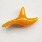 Orange curved plastic acupressure massage tool with smooth surface for use with Massage Socks reflexology therapy.